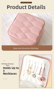 Detail of pink PU leather jewelry box with necklace hooks and quilted stitching