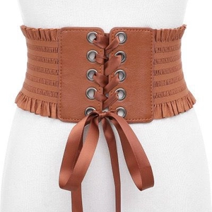 Brown elastic waist belt for women with lace-up front and pleated trim on white mannequin