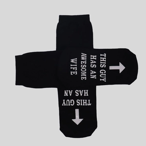 Detail of non-slip cotton socks with This Guy Has An Awesome Wife text printed on soles