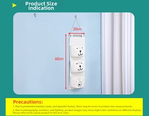 Detailed view of a 3-tier wall-mounted fabric organizer with cute cartoon prints