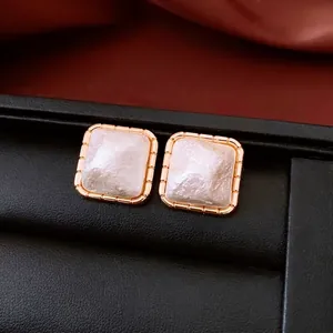 French vintage style gold-plated square studs with mother-of-pearl texture and ribbed borders