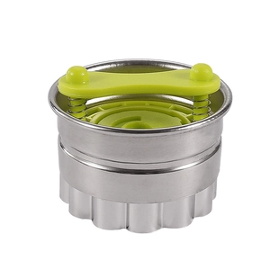 Modern stainless steel cookie cutter tool with green spring handle on white background