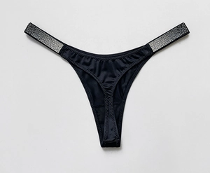 Detailed view of black satin thong featuring shimmering rhinestone waist straps and soft fabric
