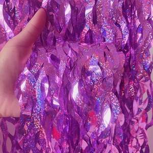 Detail showing the laser texture and glittering effect of purple S-shaped foil fringe