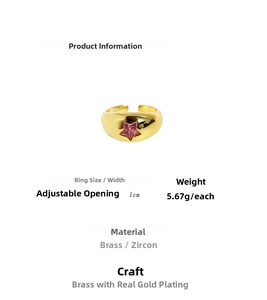 Detail of adjustable brass ring featuring pink zircon star and gold plating specs