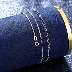 Detail of silver S925 sterling silver cross chain with lobster clasp on velvet