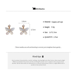 Detail view of gold butterfly earrings with cat eye stones and cubic zirconia dimensions