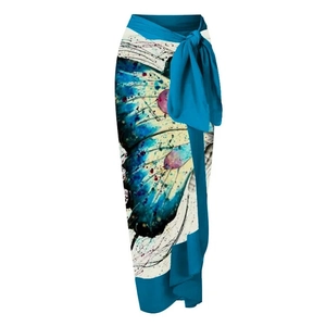 One-shoulder swimsuit set with floral accents and butterfly print sarong wrap skirt