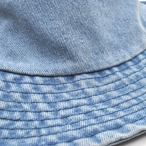Classic light blue denim bucket hat featuring reinforced stitching and sun protection