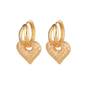 Elegant gold heart earrings with shimmering pave-set cubic zirconia for festive women