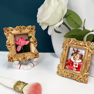 European vintage gold photo frame with ornate carving and astronaut ornament for home decor