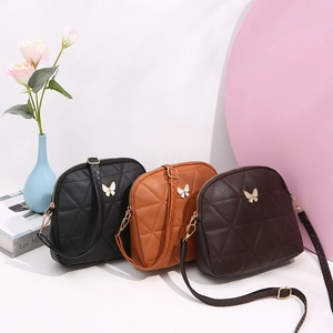 Stylish quilted shell crossbody bags with golden butterfly buckles in black and brown