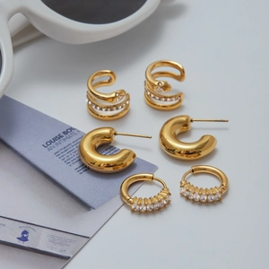 Three pairs of gold-plated stainless steel earrings set with sparkling zircon stones