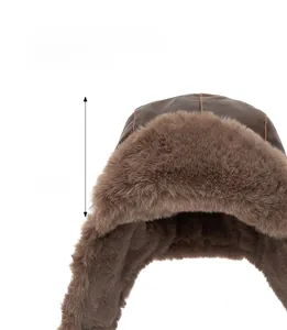 Detail showing the 15cm deep interior of brown faux leather winter trapper hat with warm fur