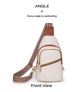 Close-up of contrast leather crossbody bag with lychee texture and woven shoulder strap