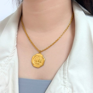 Detailed close-up of 18K gold-plated octagonal portrait pendant necklace for women