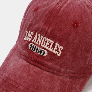 Detail of vintage washed red cotton baseball cap with Los Angeles 1950 3D embroidery