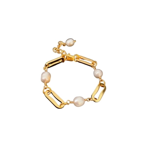 Gold plated chain bracelet with irregular freshwater pearls in a minimalist design