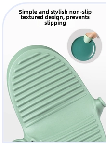Detail of shark-shaped silicone heat resistant oven mitt with non-slip ridges for grip