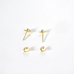 Detailed view of gold plated S925 sterling silver cross stud earrings with hallmarked backs