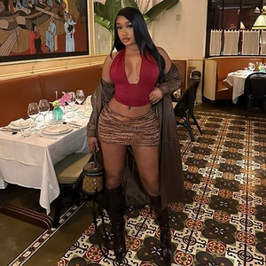 Fashionable red halter neck V-neck vest top paired with a stylish brown textured skirt