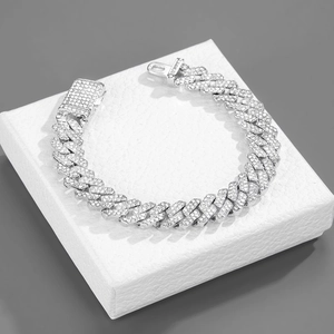 Detailed macro view of 12mm silver Cuban link bracelet with iced-out pave rhinestones