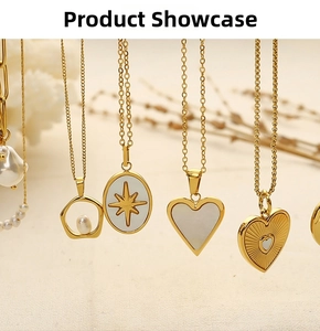 Collection of 18k gold plated heart and pearl necklaces on a soft white fabric