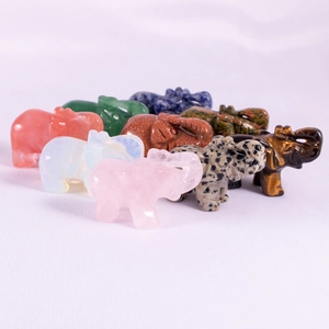 Detailed collection of 1.5-inch carved crystal elephant figurines in various gemstones