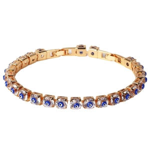 Golden chain bracelet featuring blue evil eye charms with cubic zirconia on white background