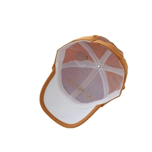 Interior view of children's dinosaur baseball cap with reinforced stitching and white lining