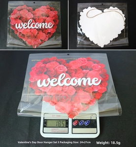 Detail view of Valentine's heart door hanger with red roses and welcome text