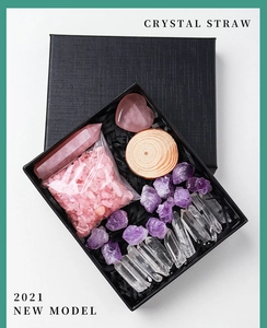 Natural crystal gift set featuring amethyst raw stones and rose quartz heart in a black box