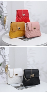 Close-up of quilted chain bags in various colors featuring golden heart-shaped metal clasps