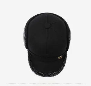Detail view of winter baseball cap showing fleece lining, ear flaps and gold ny logo