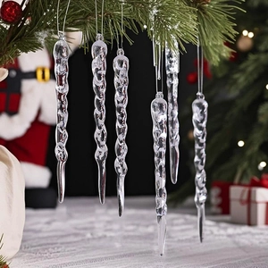 Clear acrylic spiral icicle ornaments hanging on Christmas tree branches with festive bokeh