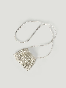 Macro detail of silver metallic sequins and handcrafted mesh texture on mini crossbody bag