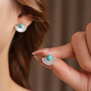 Vintage fan-shaped stainless steel stud earrings featuring natural turquoise inlay