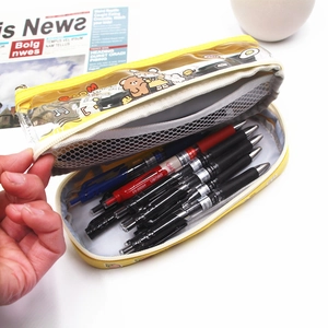 Vue intérieure de la trousse transparente jaune à double couche avec motif cartoon et filet
