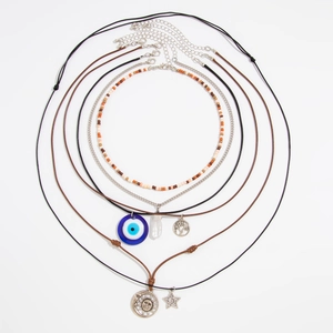 6-piece bohemian layered necklace set with evil eye sun star and tree of life pendants