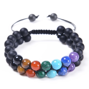 Close-up of double-layer braided 8mm natural stone chakra bracelet with adjustable cord