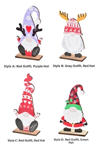 Detail view of 4 festive wooden Christmas gnomes with colorful holiday patterns