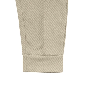Macro shot showing twill fabric texture and precise stitching on the khaki suit cuff