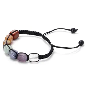 Handmade woven bracelet featuring seven chakra natural stones with black cord detail