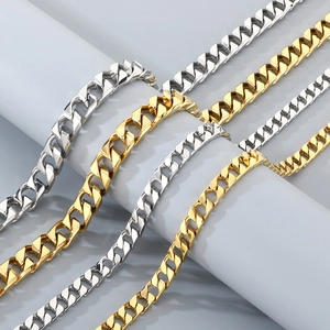 Classic gold and silver stainless steel Cuban link necklaces for men on display