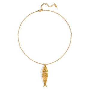 Detailed macro view of a gold fish pendant necklace featuring scales and a diamond eye detail