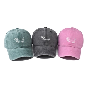 Vintage washed cotton baseball caps with dog embroidery in green, grey, and pink colors