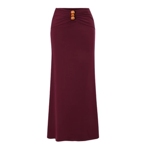 Detail of wine red maxi skirt with waist pleats and bohemian wooden bead accents