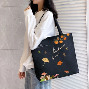 Large black canvas tote bag with Autumn Harvest hedgehog print for women on shoulder