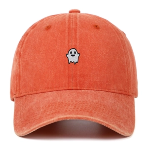 Close-up of ghost embroidery on washed cotton baseball cap with vintage texture