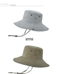 Detail showing two wide-brim outdoor sun hats with ventilation eyelets and chin straps